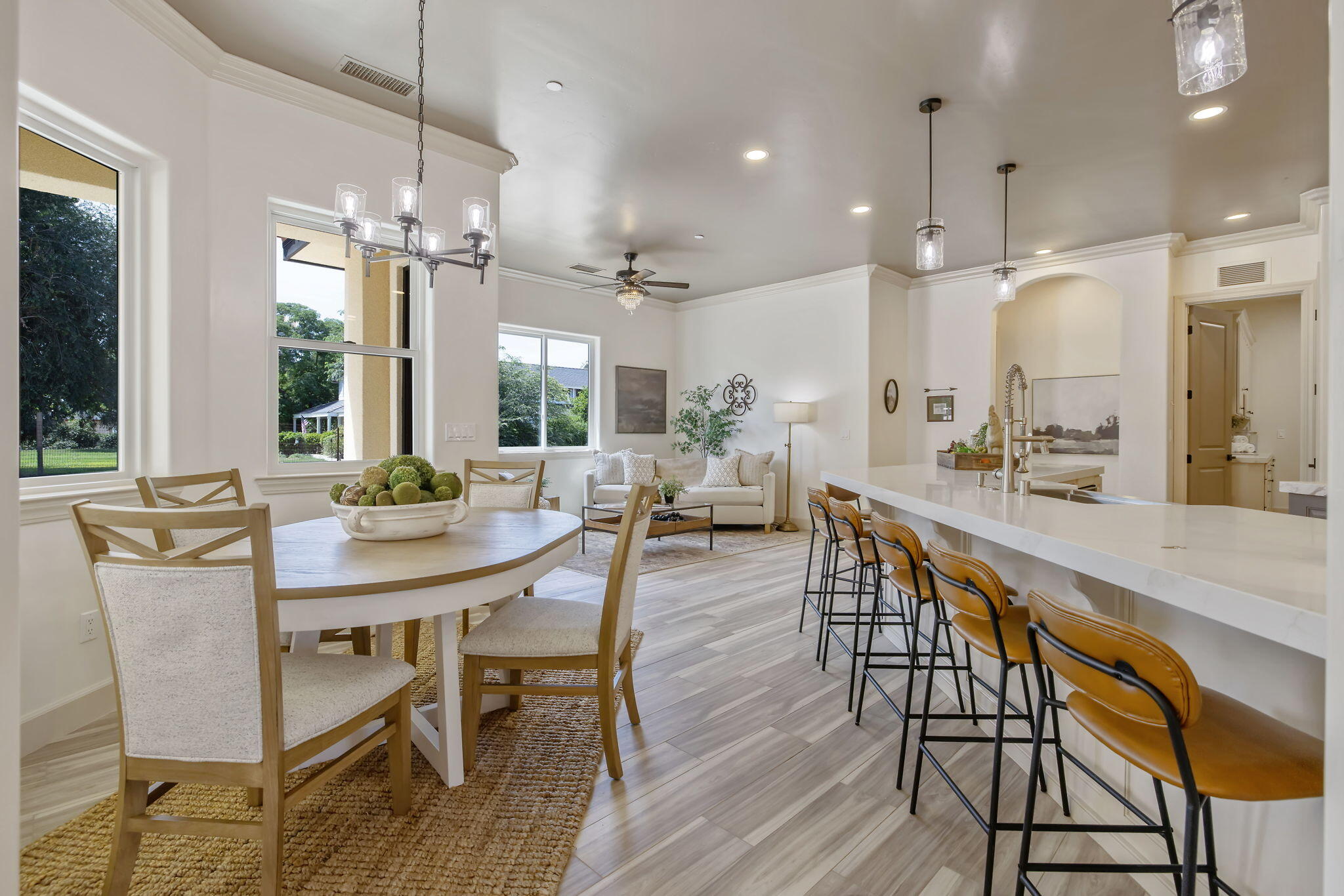 503 East Palm Street Exeter, CA 93221 - Photo 28 of 92 a view of a dining room and livingroom with furniture wooden floor a chandelier