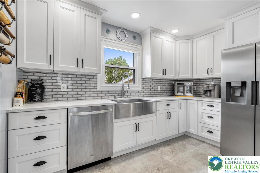 3340 Bridlepath Road Easton, PA 18045 - Photo 13 of 52 a kitchen with cabinets appliances a sink and a window
