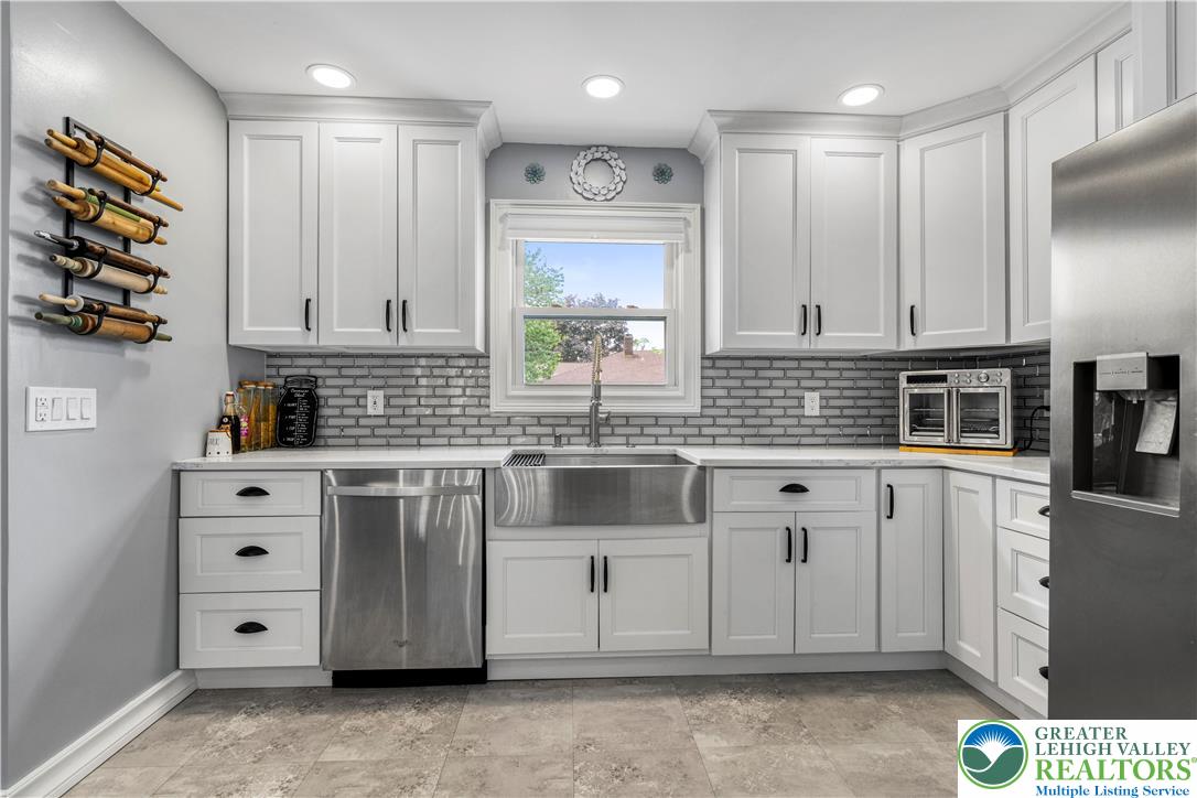 3340 Bridlepath Road Easton, PA 18045 - Photo 14 of 52 a kitchen with stainless steel appliances granite countertop a sink a stove and cabinets