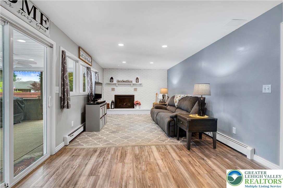 3340 Bridlepath Road Easton, PA 18045 - Photo 24 of 52 a living room with furniture and a fireplace