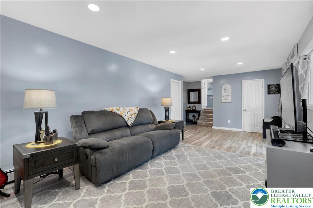 3340 Bridlepath Road Easton, PA 18045 - Photo 25 of 52 a living room with furniture and a flat screen tv