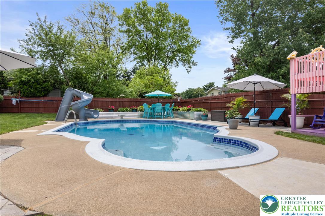 3340 Bridlepath Road Easton, PA 18045 - Photo 33 of 52 a view of a swimming pool with a patio