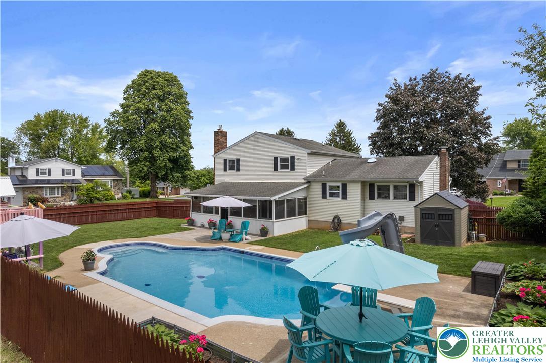 3340 Bridlepath Road Easton, PA 18045 - Photo 34 of 52 a view of an house with swimming pool and chairs
