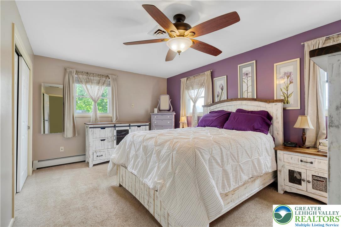 3340 Bridlepath Road Easton, PA 18045 - Photo 39 of 52 a bedroom with a large bed and a large window