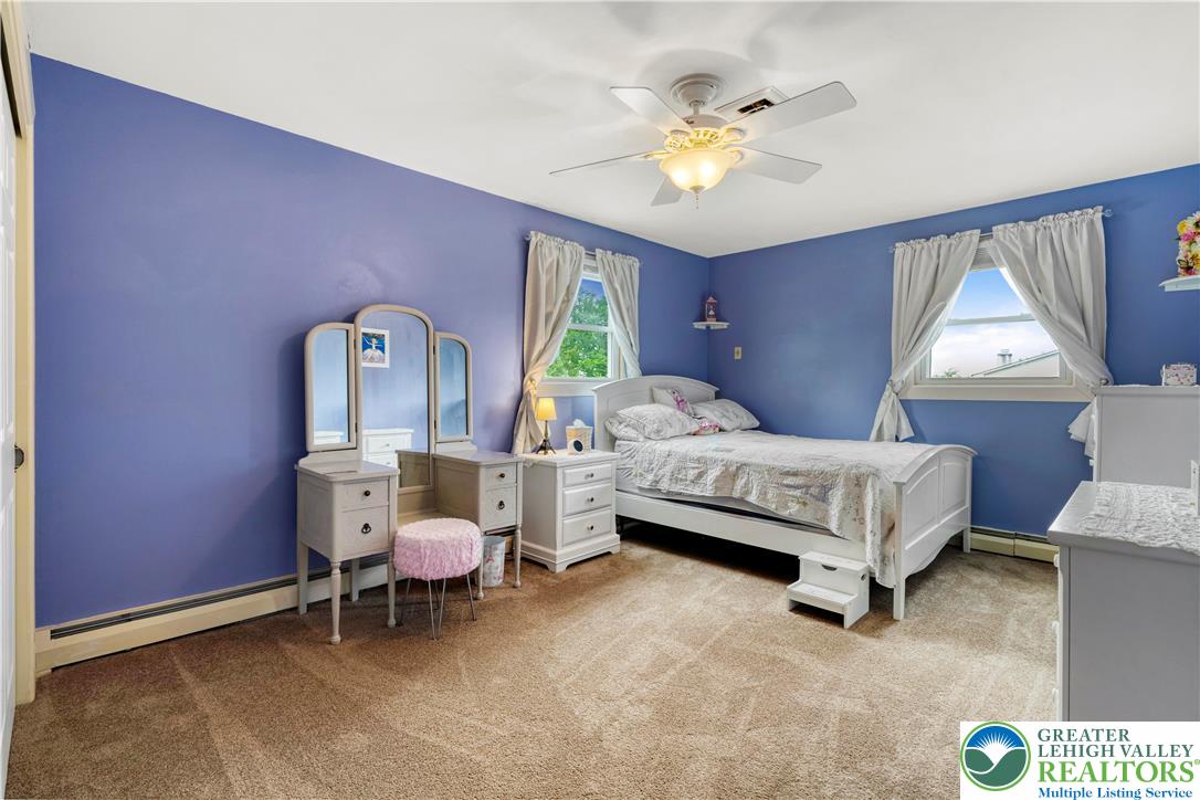 3340 Bridlepath Road Easton, PA 18045 - Photo 43 of 52 a bedroom with a bed and a chandelier