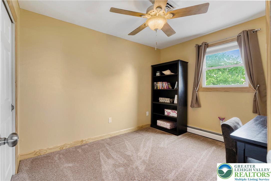 3340 Bridlepath Road Easton, PA 18045 - Photo 44 of 52 a view of an empty room with a window and a ceiling fan