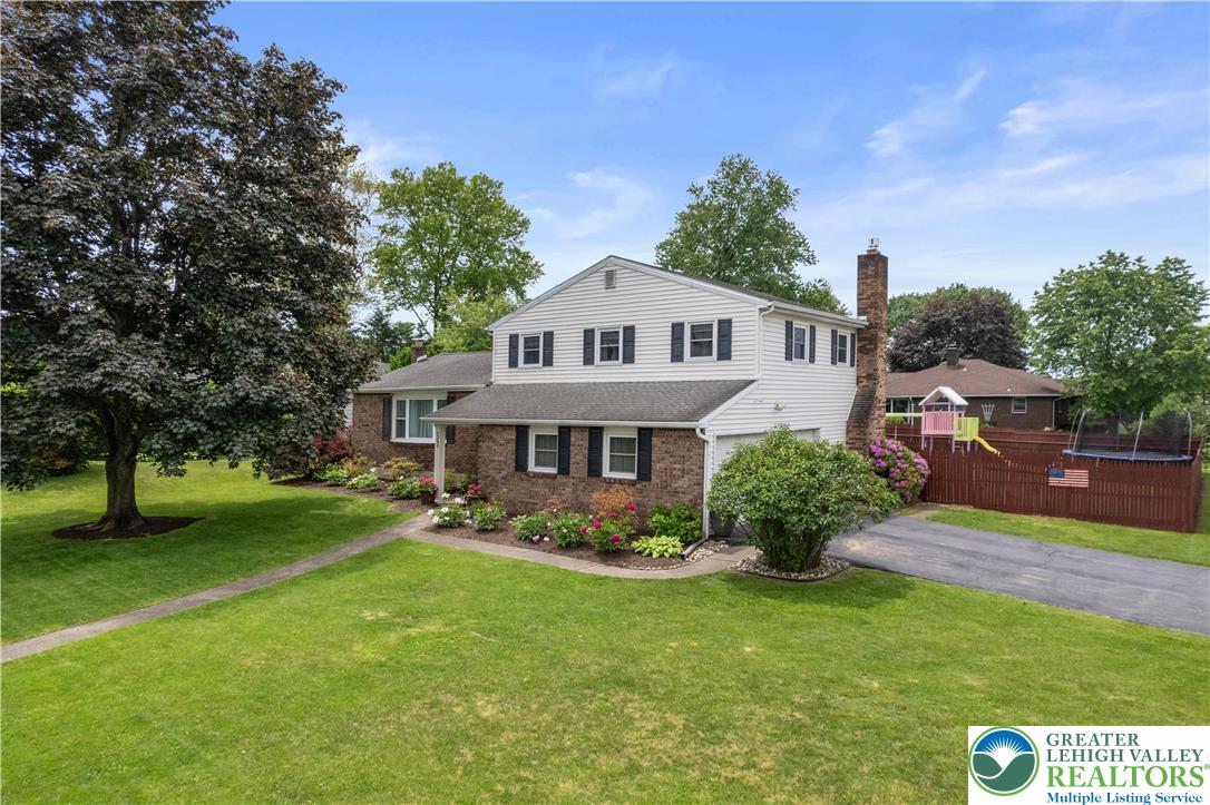3340 Bridlepath Road Easton, PA 18045 - Photo 5 of 52 a front view of a house with garden