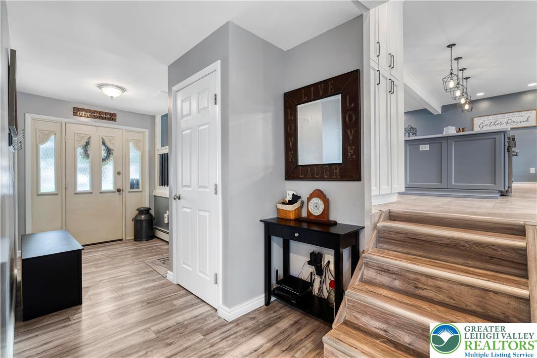 3340 Bridlepath Road Easton, PA 18045 - Photo 8 of 52 a view of a hallway view with wooden floor and staircase
