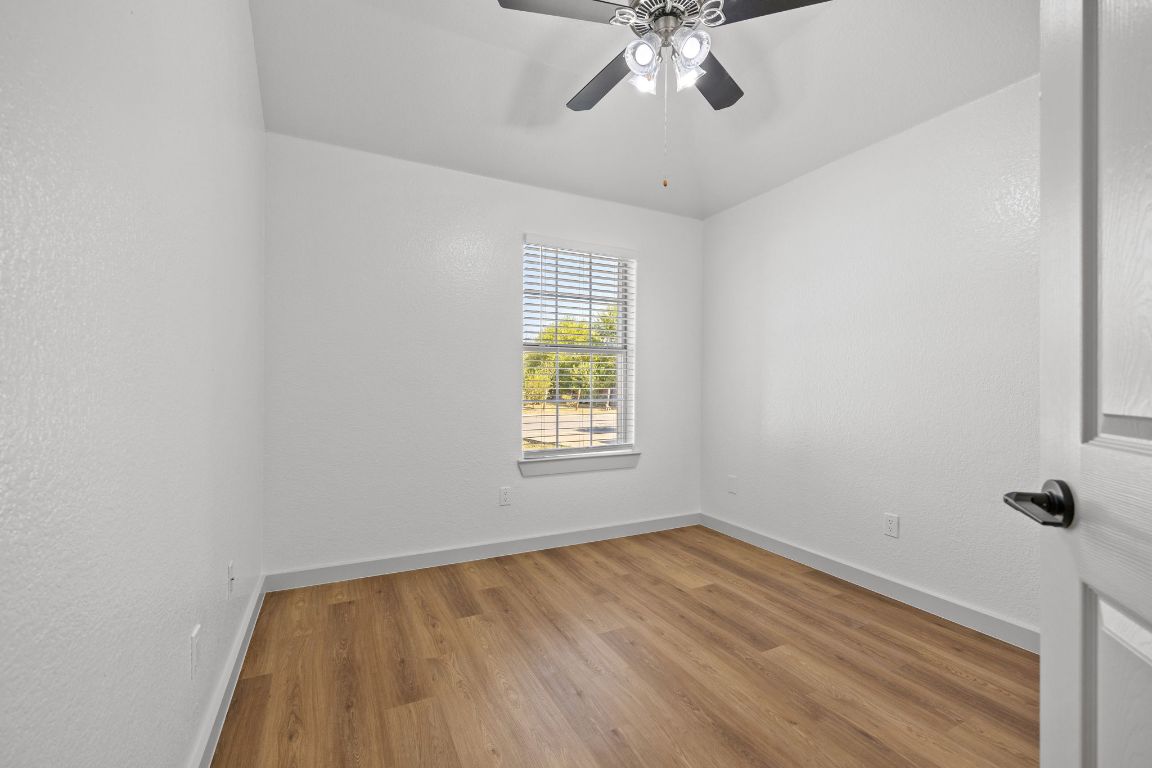 2303 Thomas Street Taylor, TX 76574 - Photo 10 of 16 an empty room with a window