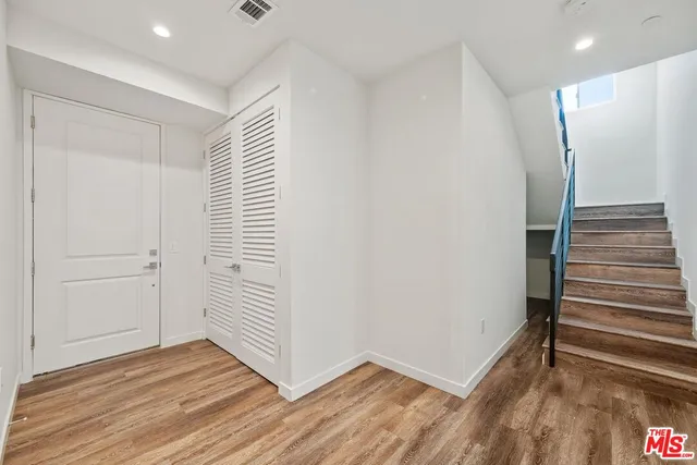 a view of wooden floor in an empty room