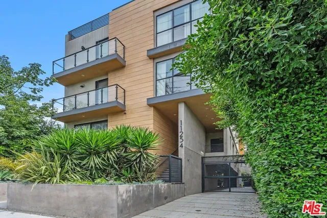 front view of a house with a tree
