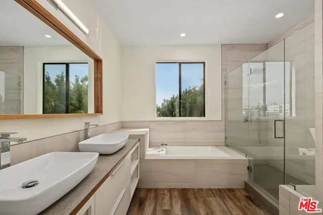 a bathroom with a bathtub and a sink