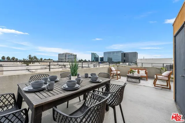 a view of a terrace with furniture and stove