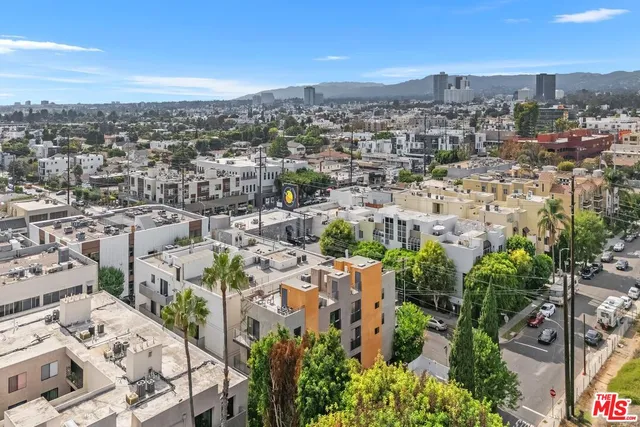 a front view of a building with outdoor seating