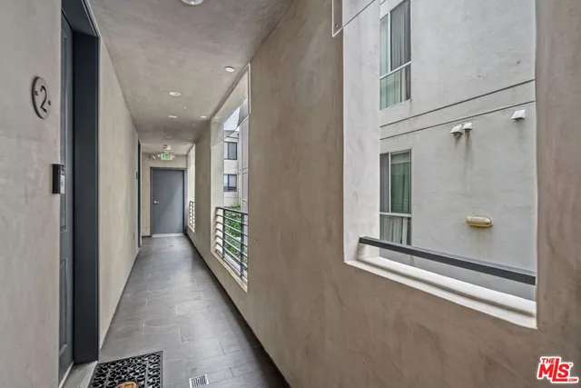 a view of a hallway with windows