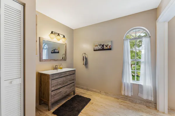 a view of room with window and wooden floor