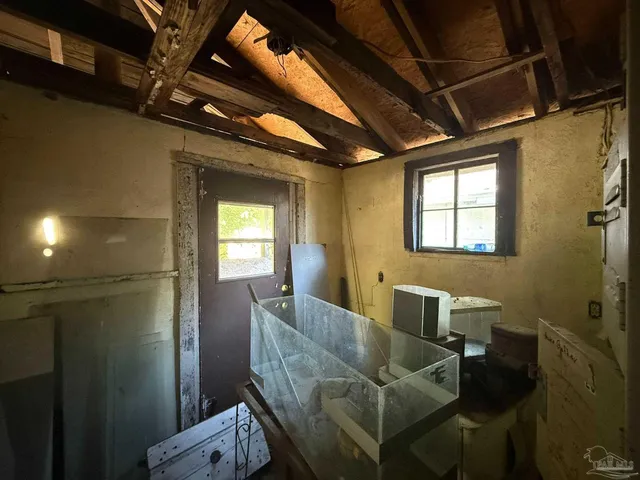 a view of a chairs and table in the patio