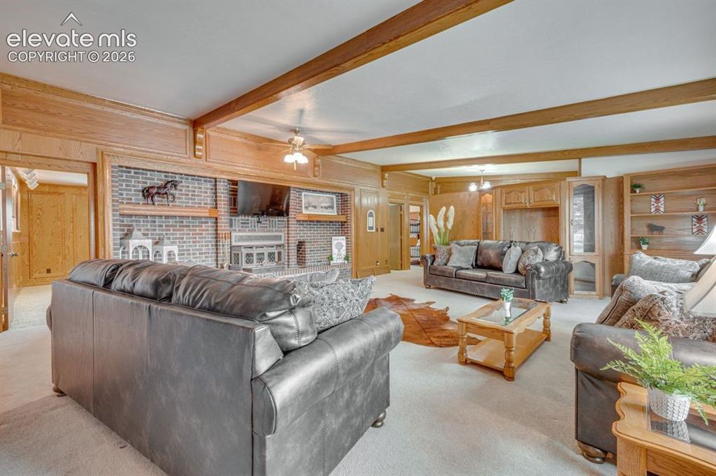 24760 Jones Road Calhan, CO 80808 - Photo 9 of 20 Spacious living room featuring brick wall/fireplace