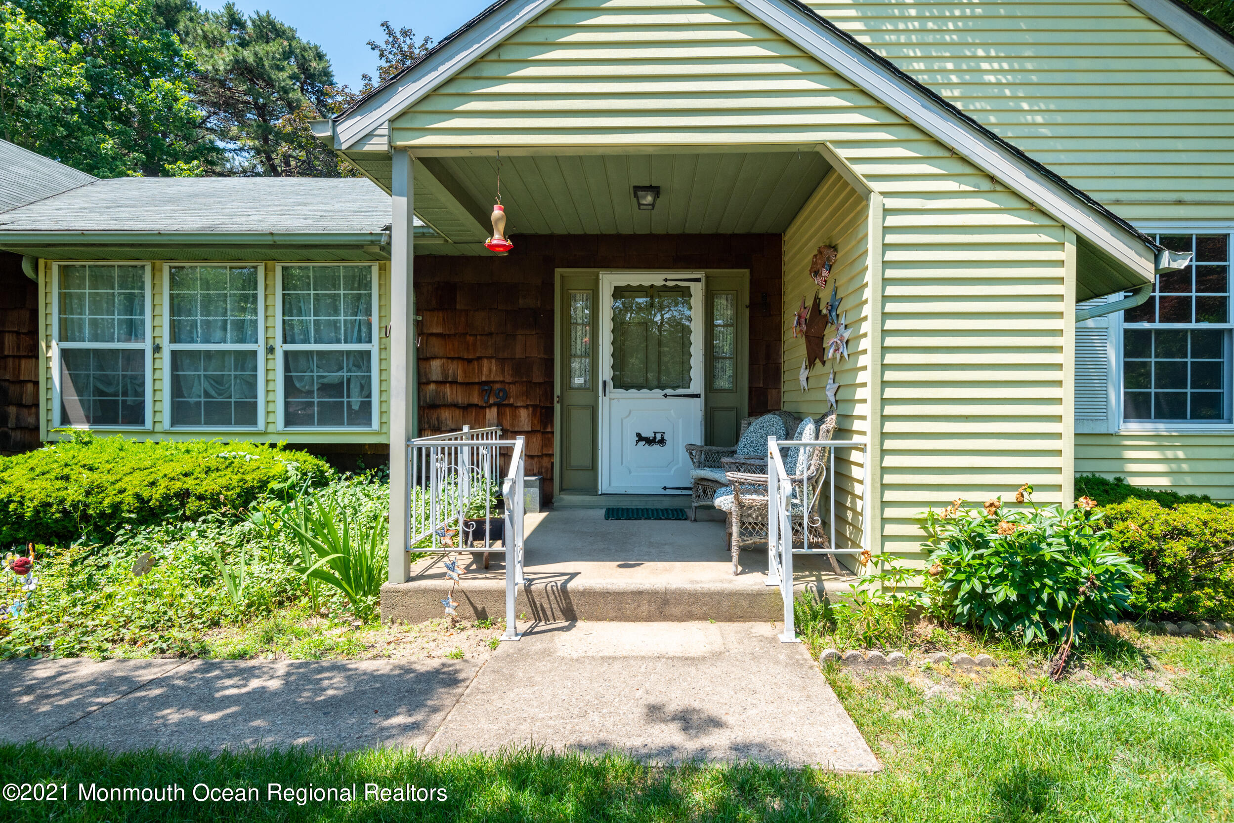 79 Sunset Road, Unit 61 Whiting, NJ 08759 - Photo 3 of 30 a front view of a house with garden