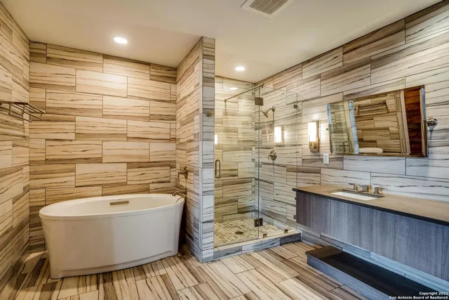 a bathroom with a bathtub and a sink