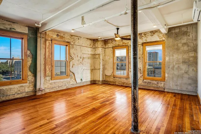 a view of an empty room with glass door