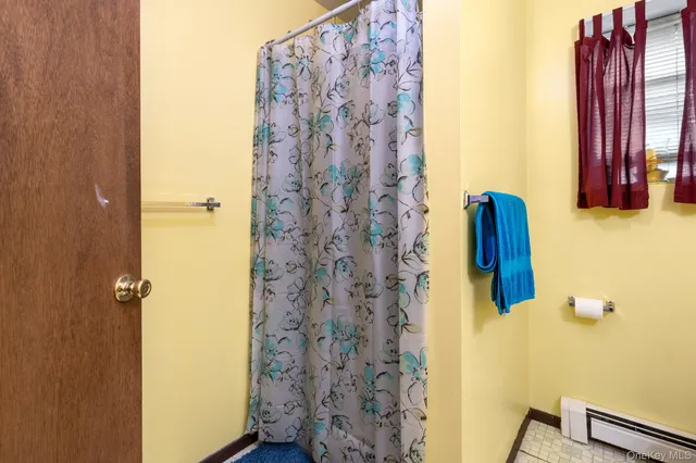 a bathroom with a shower curtain