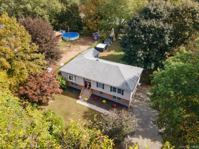 a view of a backyard with sitting area