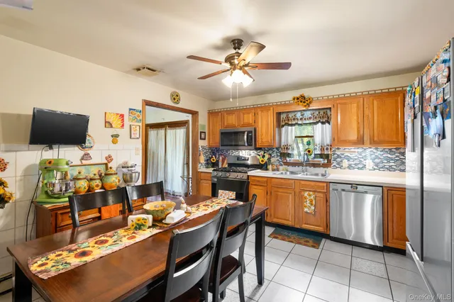 a large kitchen with a table and chairs