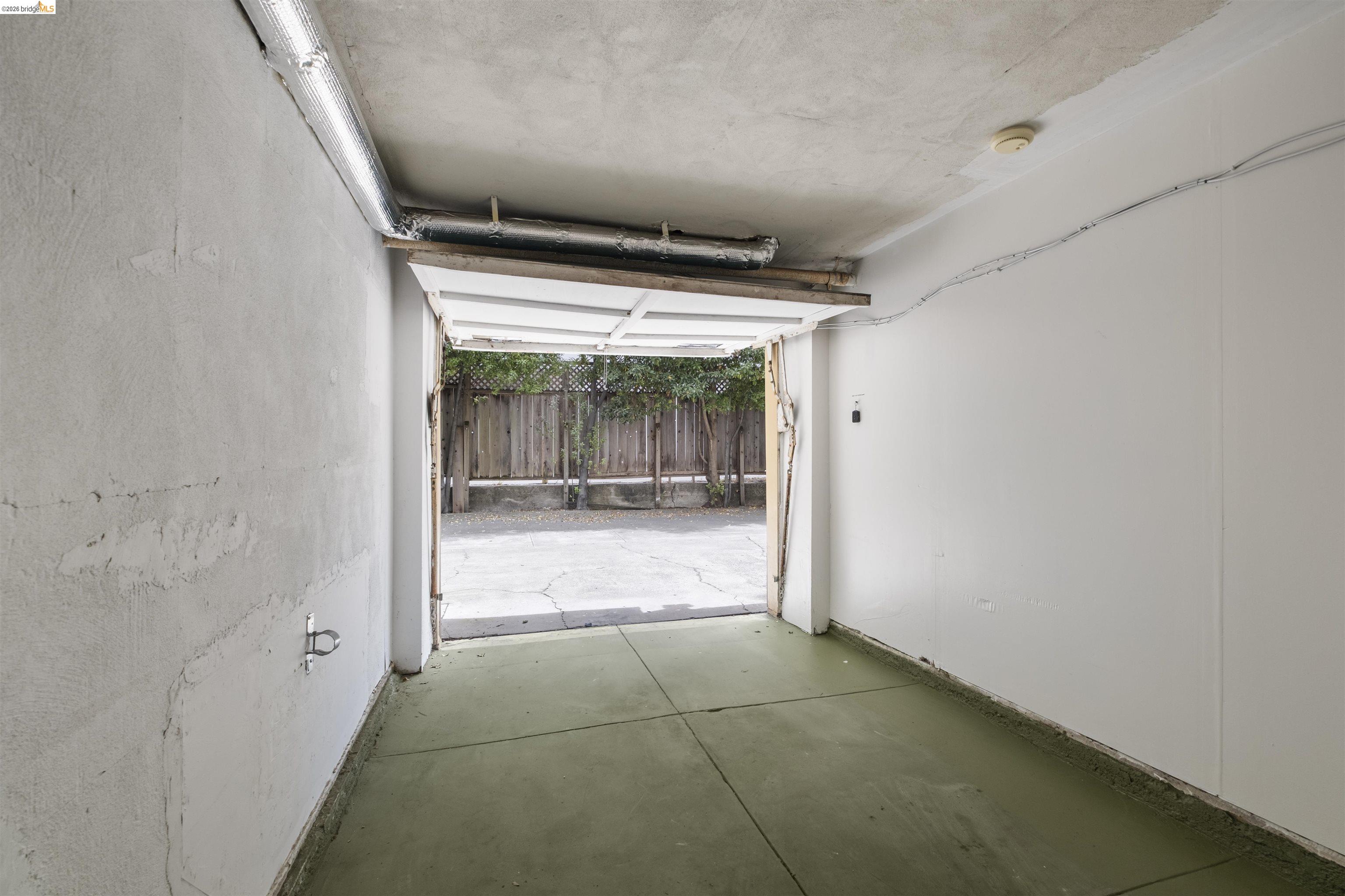 2444 Virginia Street, Unit B Berkeley, CA 94709 - Photo 39 of 39 Garage interior with concrete flooring and exposed overhead ductwork