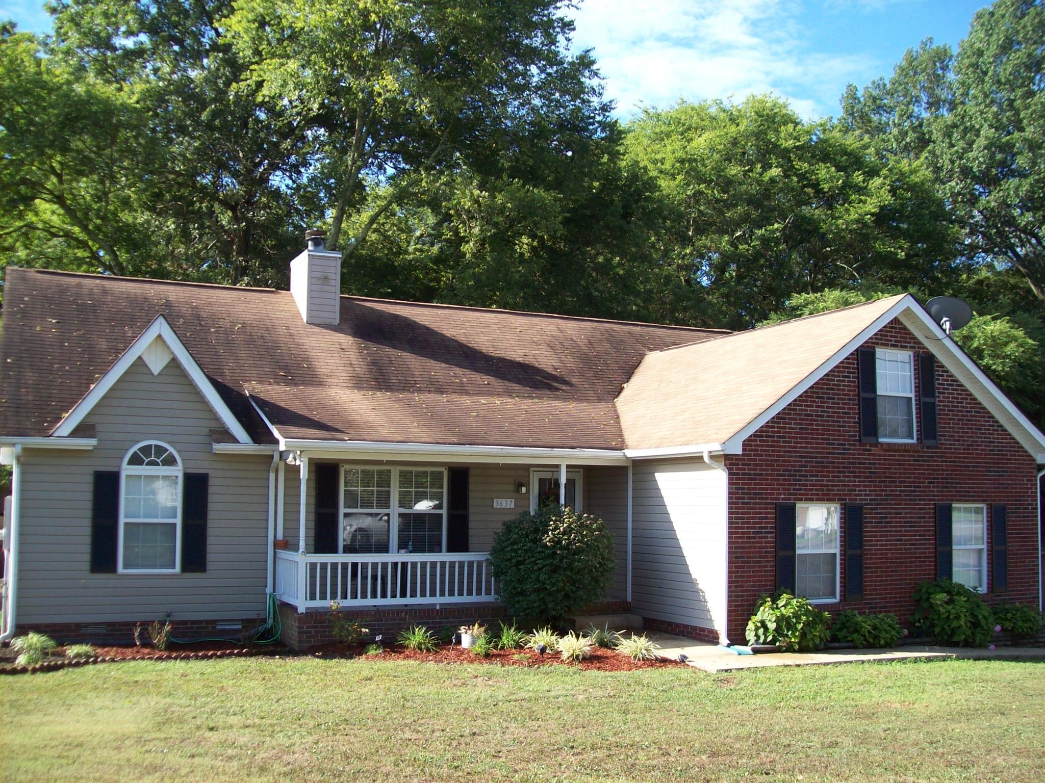 3637 Rutherford Drive Spring Hill, TN 37174 - Photo 1 of 25 a front view of a house with a yard and garage