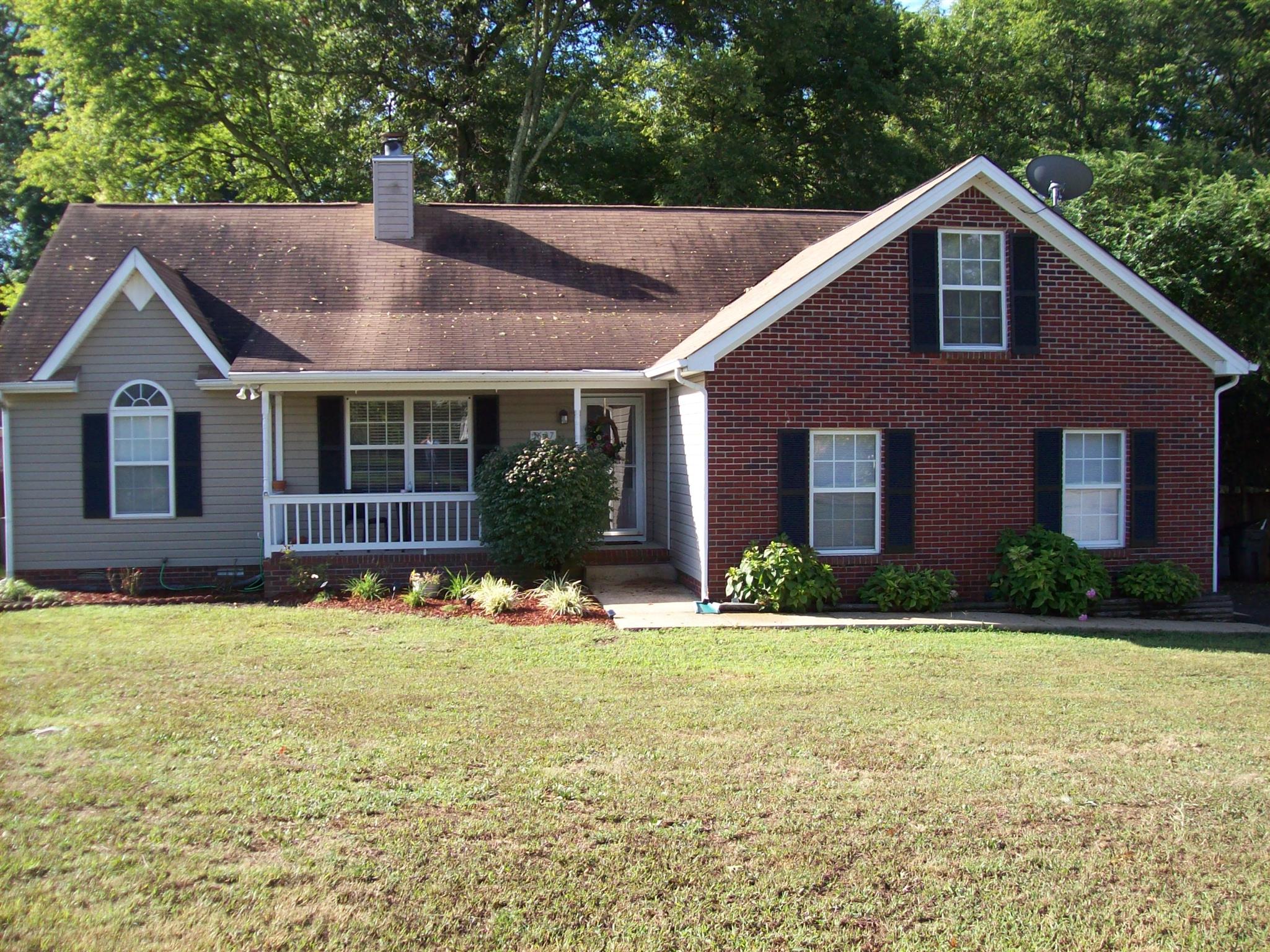 3637 Rutherford Drive Spring Hill, TN 37174 - Photo 2 of 25 a front view of a house with a yard