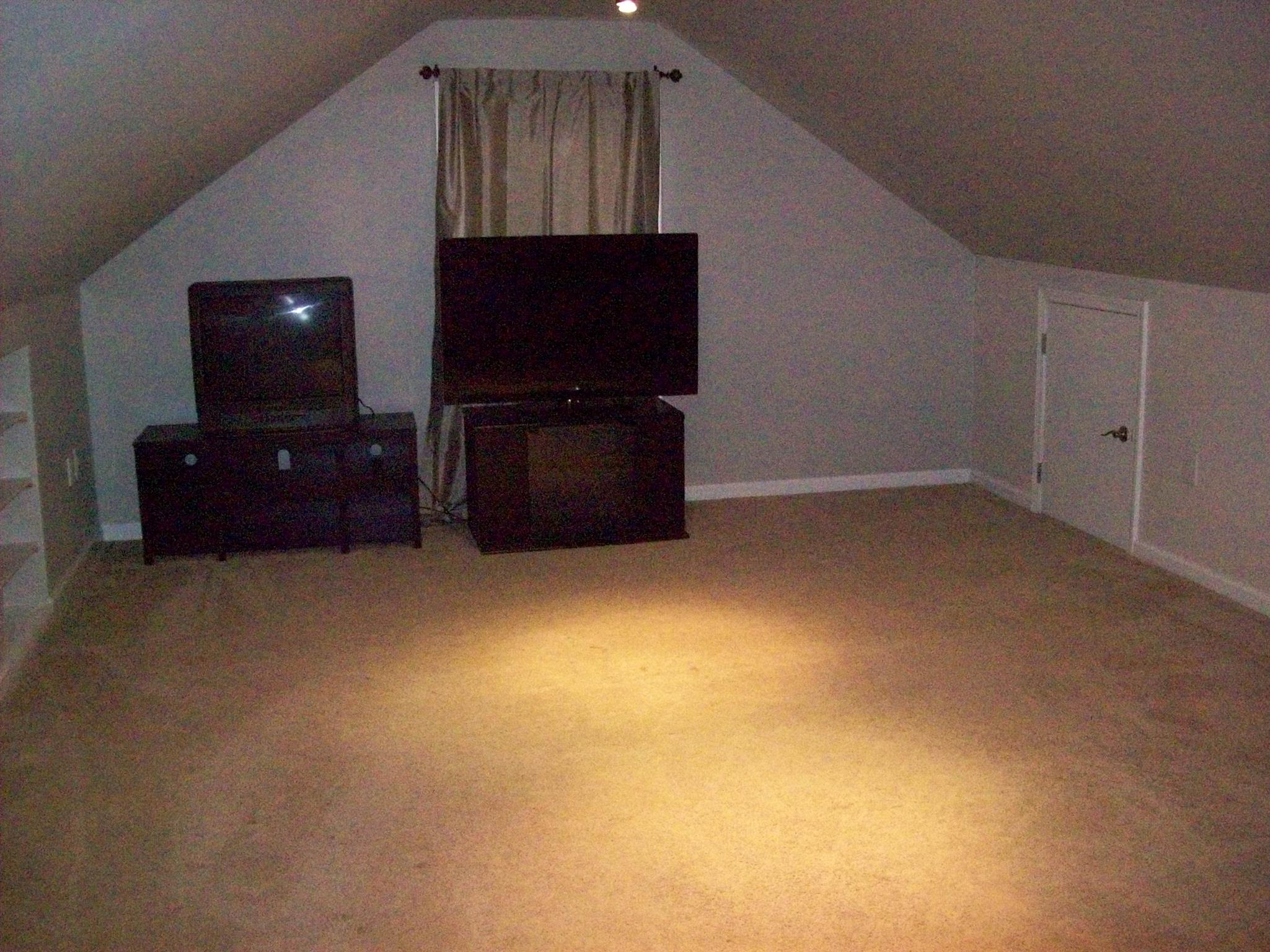 3637 Rutherford Drive Spring Hill, TN 37174 - Photo 22 of 25 a living room with a flat screen tv and dresser
