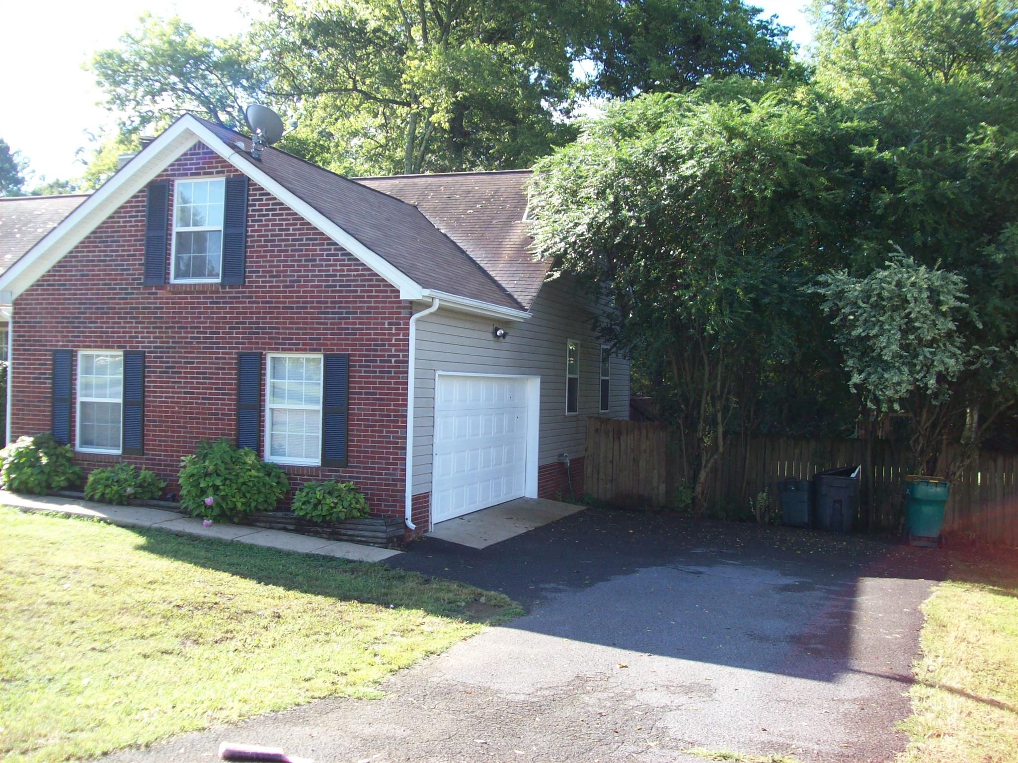 3637 Rutherford Drive Spring Hill, TN 37174 - Photo 3 of 25 a house that has a tree in front of it