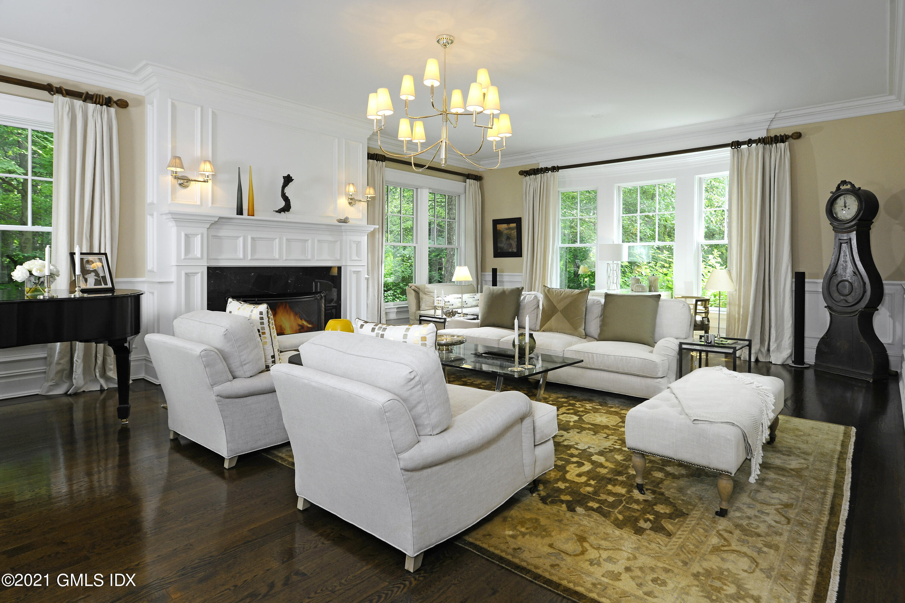 3 Hycliff Road Greenwich, CT 06831 - Photo 11 of 31 a living room with furniture a chandelier and a fireplace