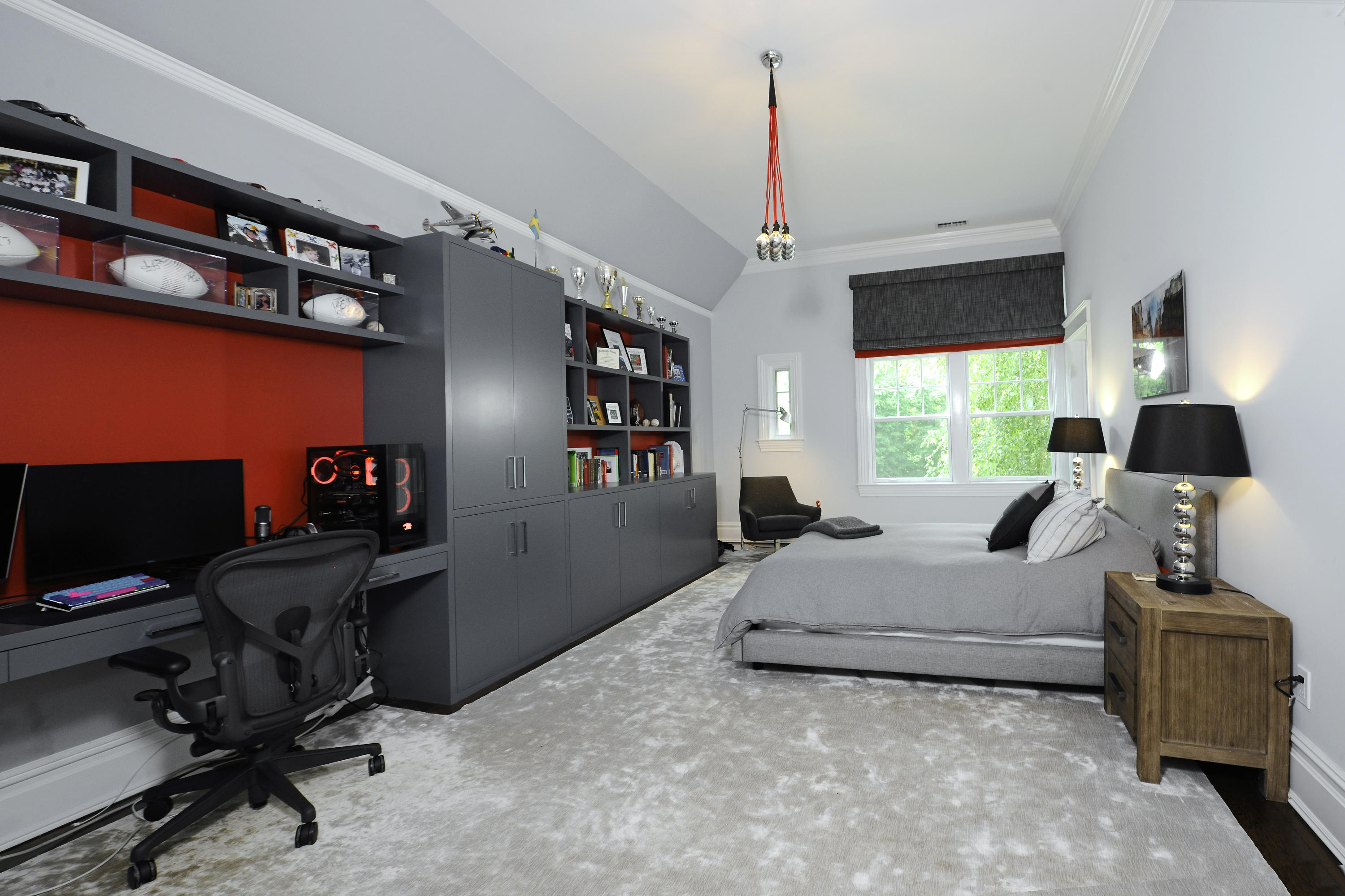 3 Hycliff Road Greenwich, CT 06831 - Photo 19 of 31 a bedroom with a bed a bookshelf and a window