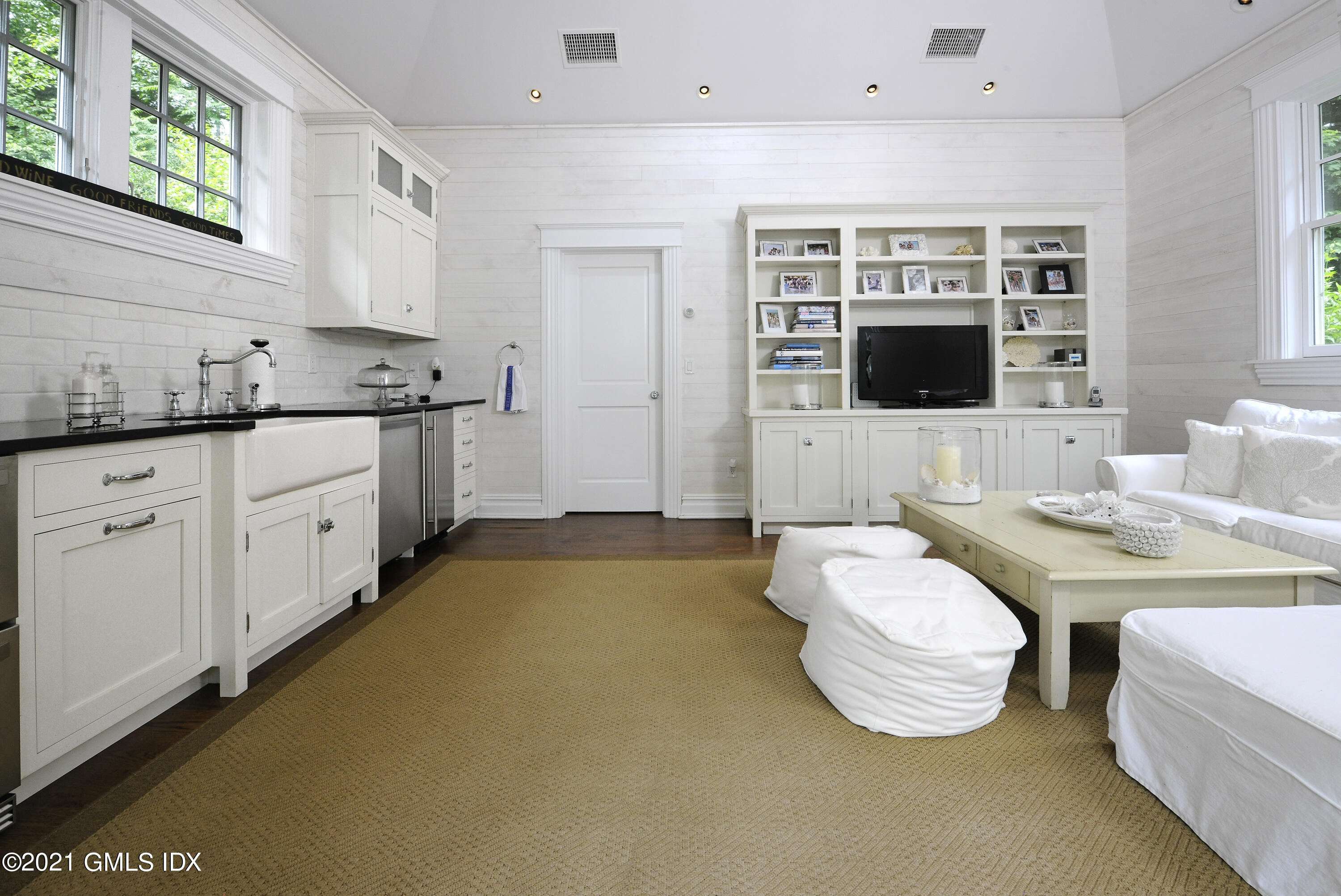 3 Hycliff Road Greenwich, CT 06831 - Photo 28 of 31 a spacious bedroom with a bed and a flat screen tv