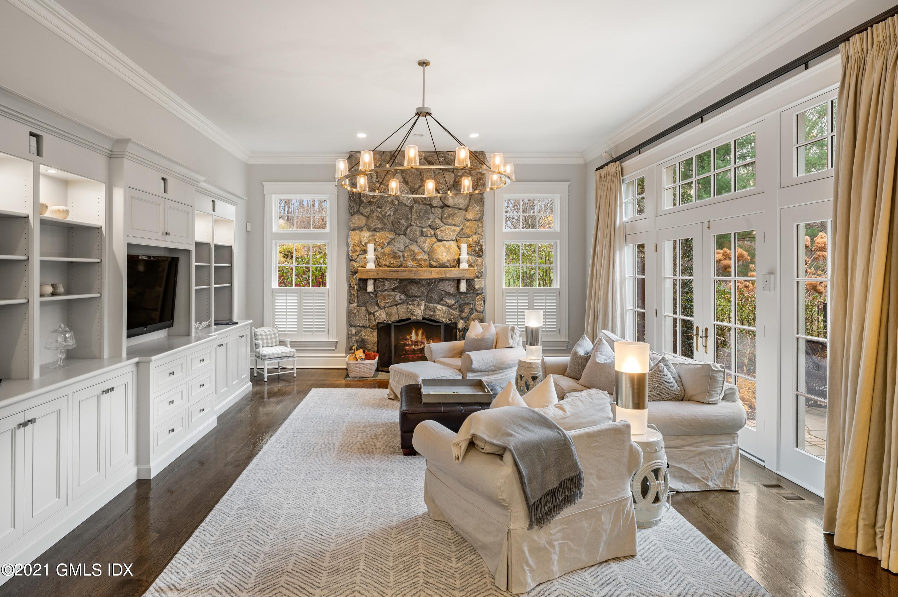 3 Hycliff Road Greenwich, CT 06831 - Photo 8 of 31 a living room with furniture fireplace and flat screen tv