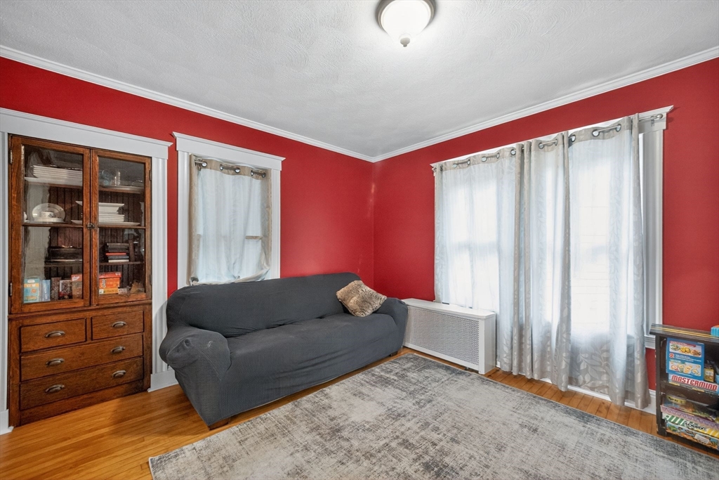 8 Corthell Road North Billerica, MA 01862 - Photo 10 of 28 a living room with furniture and a window