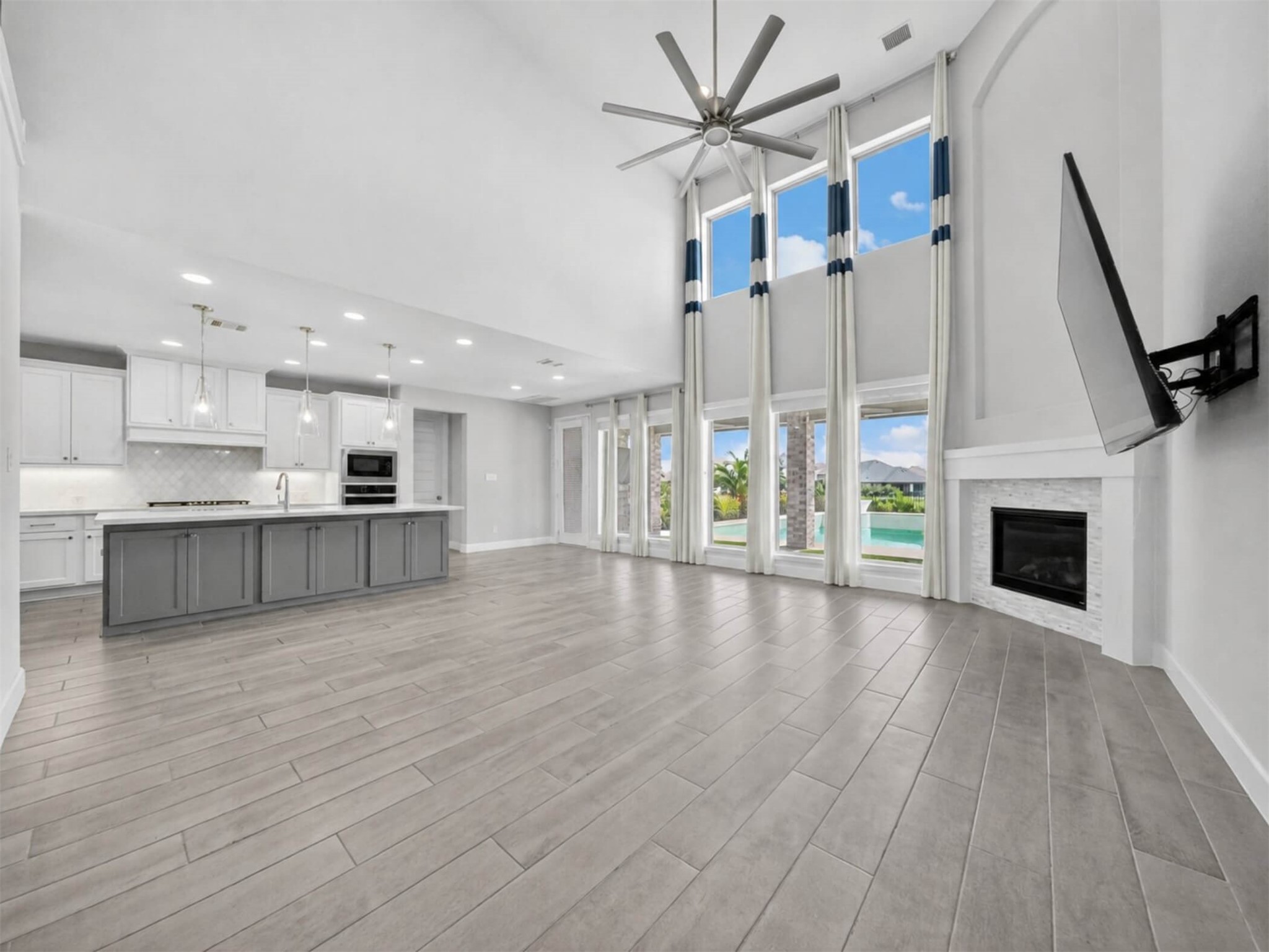 4343 Martin Ridge Drive Manvel, TX 77578 - Photo 15 of 50 a view of an empty room with wooden floor and a fireplace
