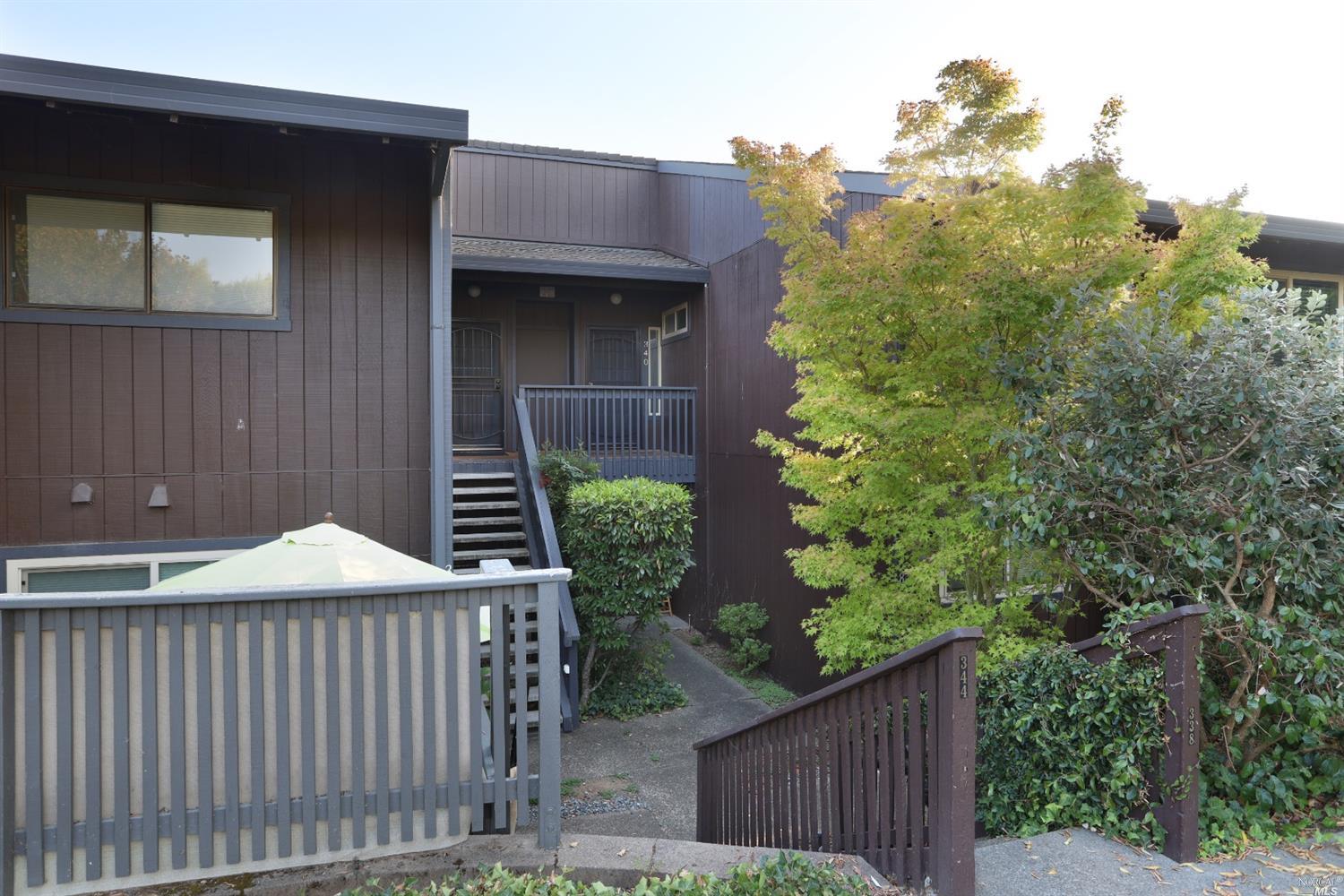 340 Los Alamos Road Santa Rosa, CA 95409 - Photo 1 of 1 a yellow house with trees in front of it