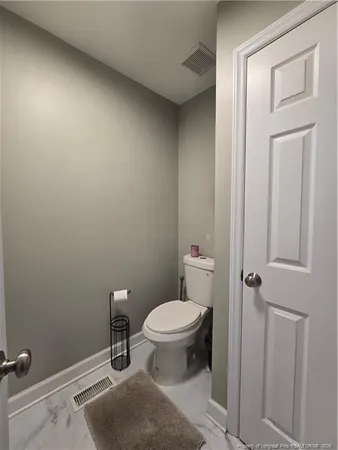 a bathroom with a toilet and a sink