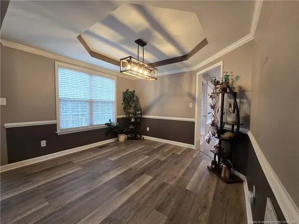 a view of a room with gym equipment and windows