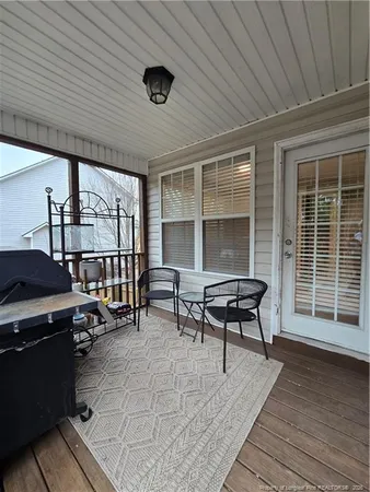 a building outdoor space with patio furniture and potted plants