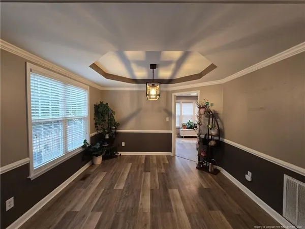 a view of a room with gym equipment and windows