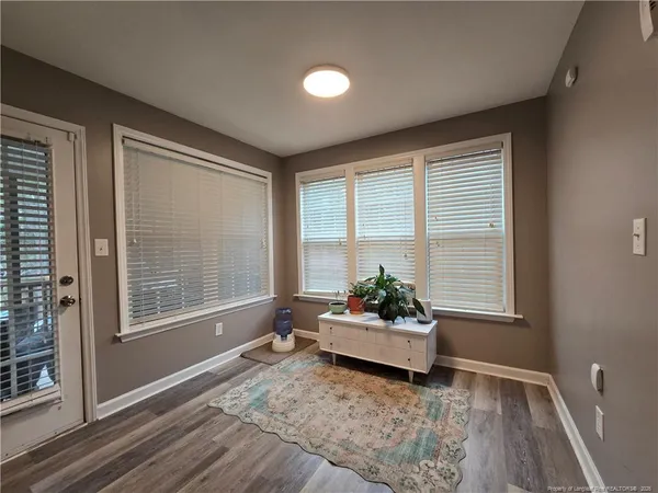 a living room with window couches and furniture