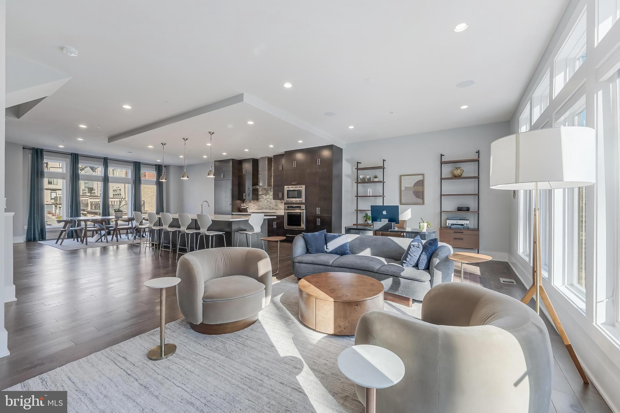 Spacious modern living area with natural light.