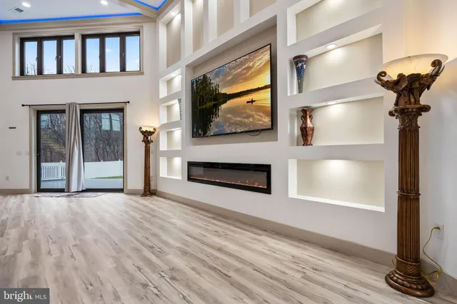 a bedroom with a bed and a night stand