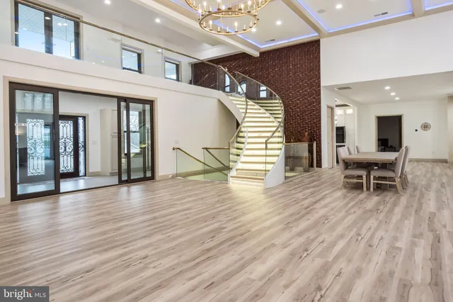 a spacious bedroom with a large bed and a large window