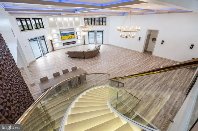 a front view of house with yard and trees in the background