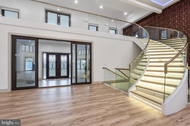 a front view of a house with a street